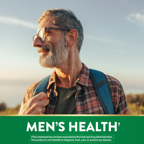 Older man with gray beard and glasses smiling outdoors, wearing a plaid shirt and backpack, for ProstAid Saw Palmetto.