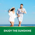 Man and woman running hand-in-hand on a sunny beach by the ocean for NT D3 Softgels.