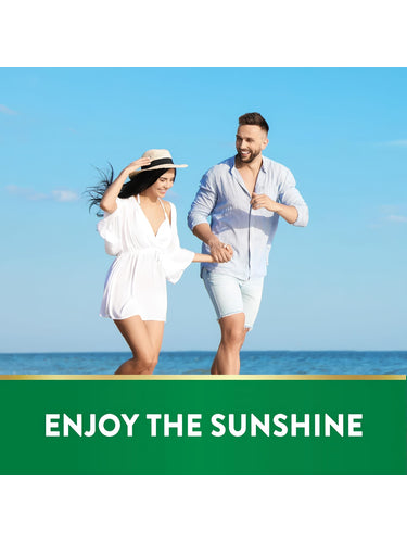 Man and woman running hand-in-hand on a sunny beach by the ocean for NT D3 Softgels.