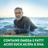 Man on surfboard in ocean, smiling. Green banner states: Contains omega-3 fatty acids such as EPA and DHA.
