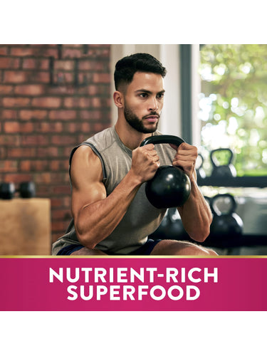 Young adult male holding a kettlebell in a squat stance at a gym with 'Nutrient-Rich Superfood' text overlay.