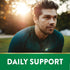 A man in athletic wear rests outdoors at sunset beside a banner graphic that states 'DAILY SUPPORT'.