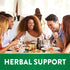 Diverse young adults enjoy laughing and eating together at a restaurant for herbal support.