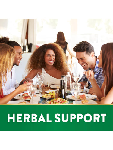 Diverse young adults enjoy laughing and eating together at a restaurant for herbal support.
