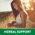 A young woman smiles while touching tall grasses in a sunlit field, symbolizing Rhodiola Rosea.