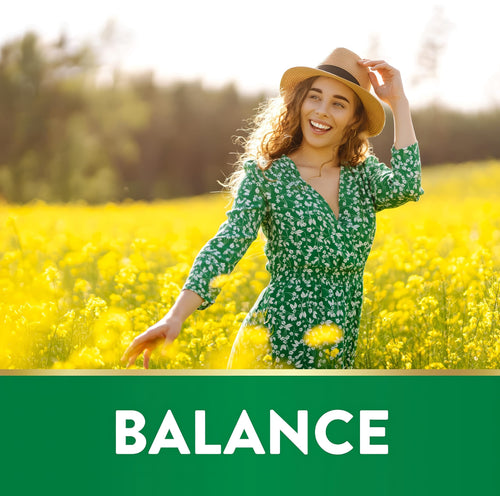 A woman smiles in a yellow flower field with 'BALANCE' text, featuring St. John's Wort.