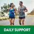 An adult man and woman run outdoors with 'DAILY SUPPORT' text promoting Calcium + D3 benefits.