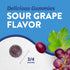 A dark purple, sugar-coated Sour Grape gummy measuring three-fourths of an inch held between fingers.
