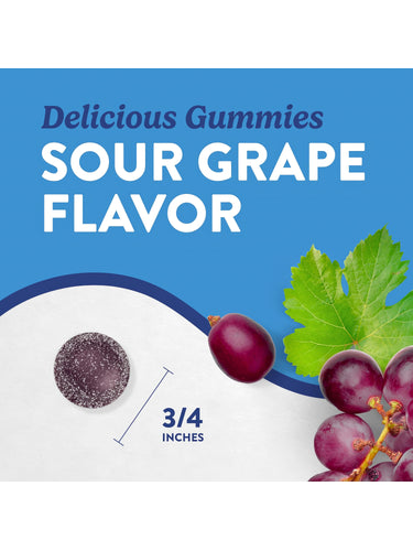 A dark purple, sugar-coated Sour Grape gummy measuring three-fourths of an inch held between fingers.