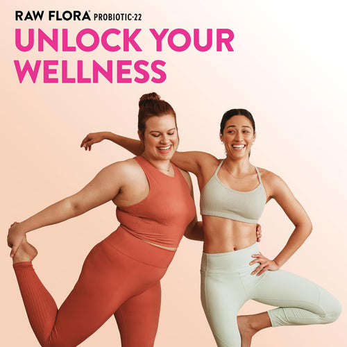 Two young women in activewear smile and pose with 'RAW FLORA PROBIOTIC-22 UNLOCK YOUR WELLNESS' text.