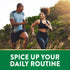 A man and woman jogging outdoors together, smiling.