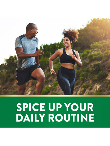 A man and woman jogging outdoors together, smiling.