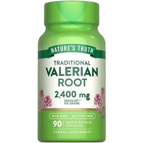 Hand holding Nature's Truth Valerian Root capsules, 2,400 mg per serving, 90 count, quick release formula.