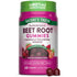 A hand holding two dark red beet root gummies, showcasing their size and color against a neutral background.