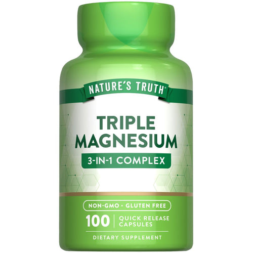 Hand holding NT Triple Magnesium Complex bottle with 100 quick release capsules.
