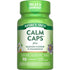Nature's Truth Calm Caps, 90 capsules shown on a hand scale, highlighting the bulk size and quantity of the product package.