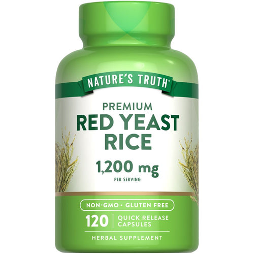 A hand holding a scale displaying a bottle of Red Yeast Rice 1,200 mg with 120 quick release capsules.