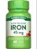 Hand holding a bottle of slow release iron tablets, 45 mg, 60 coated tablets, emphasizing dietary supplement and iron dosage.