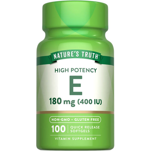 A bottle of Vitamin E 180 mg (400 IU) Quick Release Softgels, containing 100 pills, is shown on a hand scale.