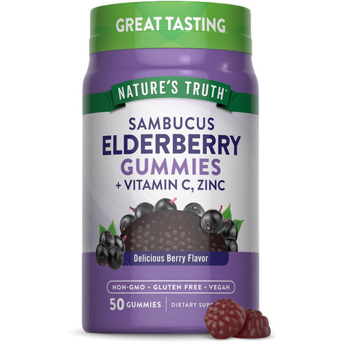 Two raspberry-shaped NT Elderberry Complex gummies, from a 50-count bottle, shown in hand.