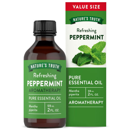 A bottle of Peppermint Essential Oil, containing 59 mL or 2 FL. OZ., placed on a hand to show scale.