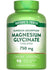 Quick Release Magnesium Glycinate Chelated 750 mg Capsules, 90 count, shown on a hand scale.