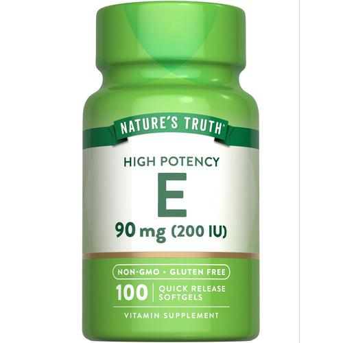 A hand holds a bottle of 100 Vitamin E Quick Release Softgels, 90 mg (200 IU).