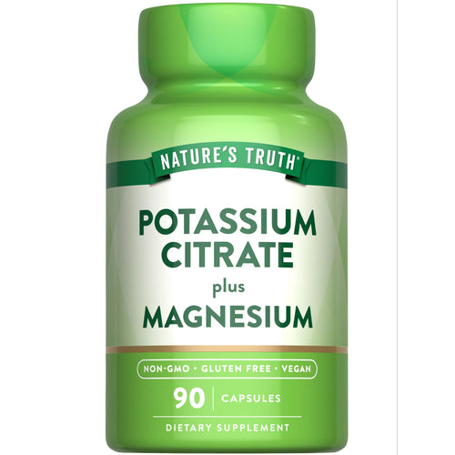View 1 A bottle of Potassium Citrate plus Magnesium with 90 capsules, held in a hand for scale, showing supplement size.