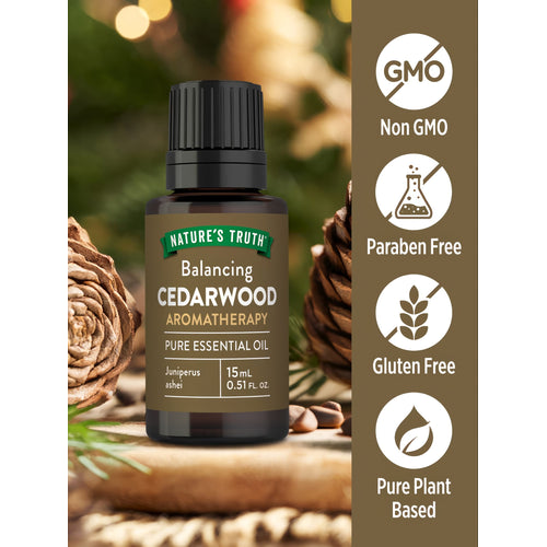 View 3 Nature's Truth Cedarwood Aromatherapy Essential Oil Juniperus ashei, 15 mL (0.51 FL. OZ.), shown in hand scale.