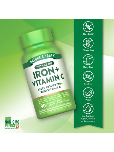 Hand holding a scale with a bottle of Iron + Vitamin C, 90 coated tablets.