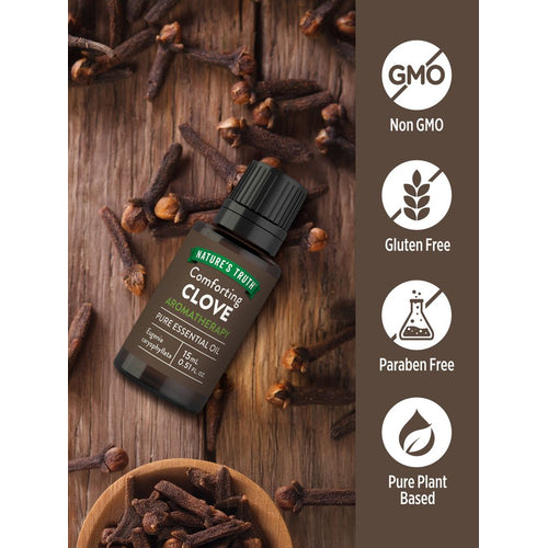A 15 mL bottle of clove essential oil with loose dried cloves and a bowl filled with cloves.