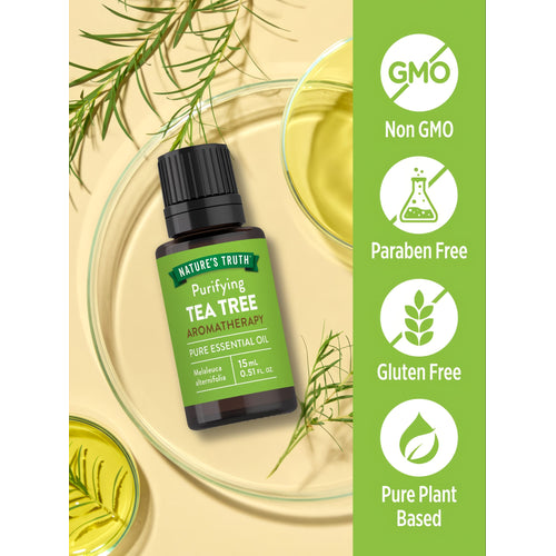 Bottle of Tea Tree Oil showing Non GMO, Paraben Free, Gluten Free, and Pure Plant Based attributes.