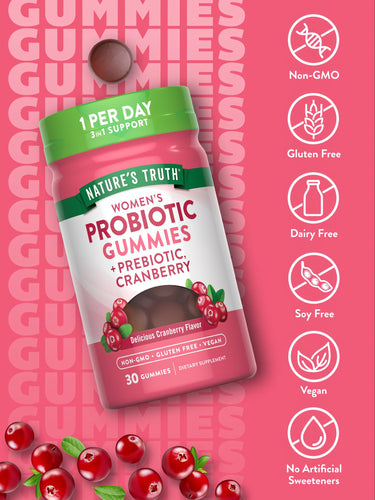 A single brown Women's Probiotic gummy shown on a hand, round in shape, indicating size for reference.