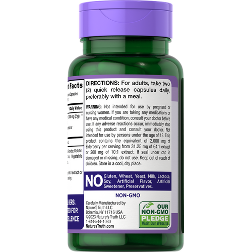 NT Elderberry 2000 mg Quick Release Capsules are visible in a clear bottle with a hand scale beside them for size reference.