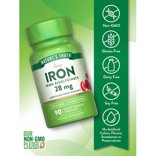 Hand holding red Quick Release Capsules containing 28 mg of iron, shown on a bulk scale.