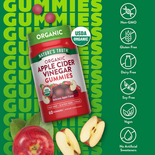 Reddish-brown organic apple cider vinegar gummies displayed next to fresh apple slices.