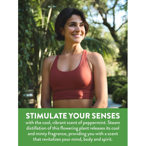 Smiling woman outdoors. Text: 'STIMULATE YOUR SENSES with the cool, vibrant scent of peppermint, revitalizing mind, body, and spirit.'