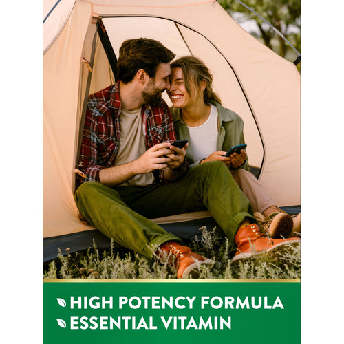 Young couple in a tent, smiling with phones, displaying text: HIGH POTENCY FORMULA ESSENTIAL VITAMIN.