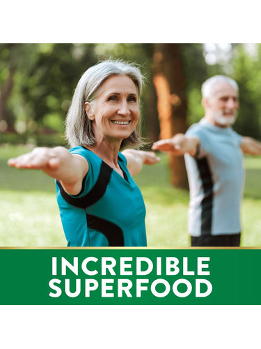 Senior woman and man doing yoga outdoors, with a green banner at the bottom stating 'INCREDIBLE SUPERFOOD'.
