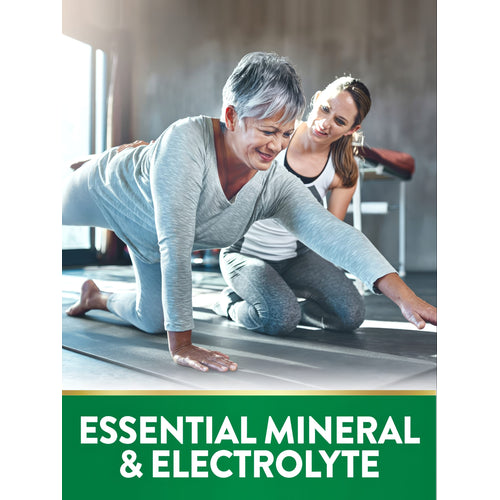 View 4 Older woman doing a balance exercise assisted by a younger woman on a yoga mat. Graphic text: ESSENTIAL MINERAL & ELECTROLYTE.