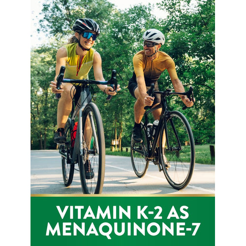 View 4 Man and woman cycling on a paved path; graphic text reads 'VITAMIN K-2 AS MENAQUINONE-7'.