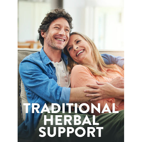 A smiling middle-aged couple relaxing on a couch with overlay text reading 'TRADITIONAL HERBAL SUPPORT'.