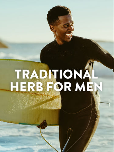Young man in a wetsuit carrying a surfboard on the beach, with text 'TRADITIONAL HERB FOR MEN'.