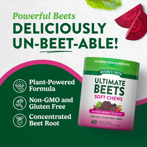 Hand holding two chocolate-colored, mixed berry flavored Ultimate Beets soft chews.
