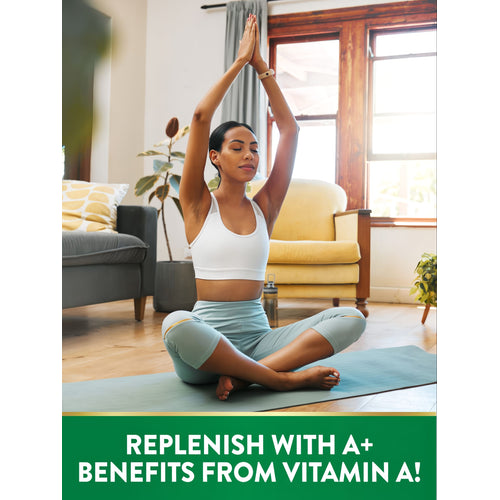 Young woman meditates on a yoga mat with hands in prayer position, representing Vitamin A.