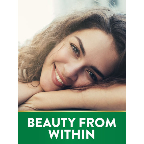 A smiling young woman rests her head on her arms, with 'BEAUTY FROM WITHIN' written on a green banner below.