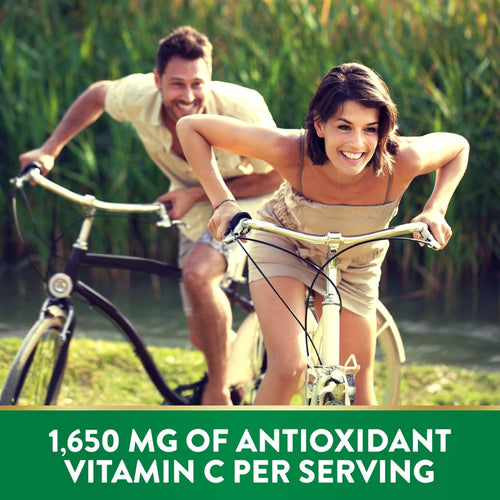 Adult man and woman smiling while riding bicycles, text states '1,650 MG OF ANTIOXIDANT VITAMIN C PER SERVING'.