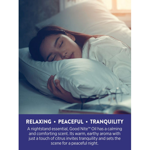 A young woman sleeps peacefully in bed after using Good Nite Oil, ensuring a restful night.