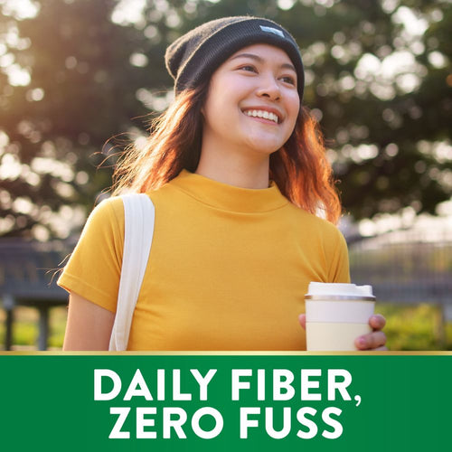 Smiling woman walks outdoors with a reusable cup. Green banner reads 'DAILY FIBER, ZERO FUSS'.