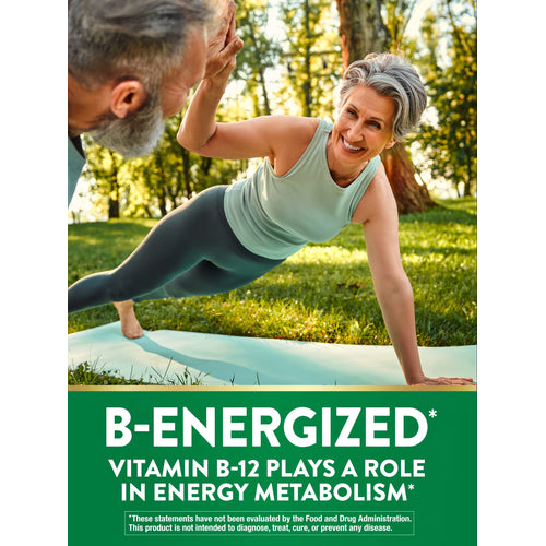Older man and woman high-fiving during outdoor workout. Graphic text: B-ENERGIZED, Vitamin B-12 plays a role in energy metabolism.